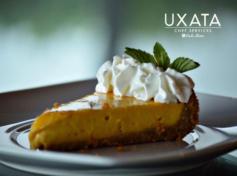 Mango pie with whipped cream and mint leaves on a plate, by UXATA Private Chef Services in Bahia Petempich