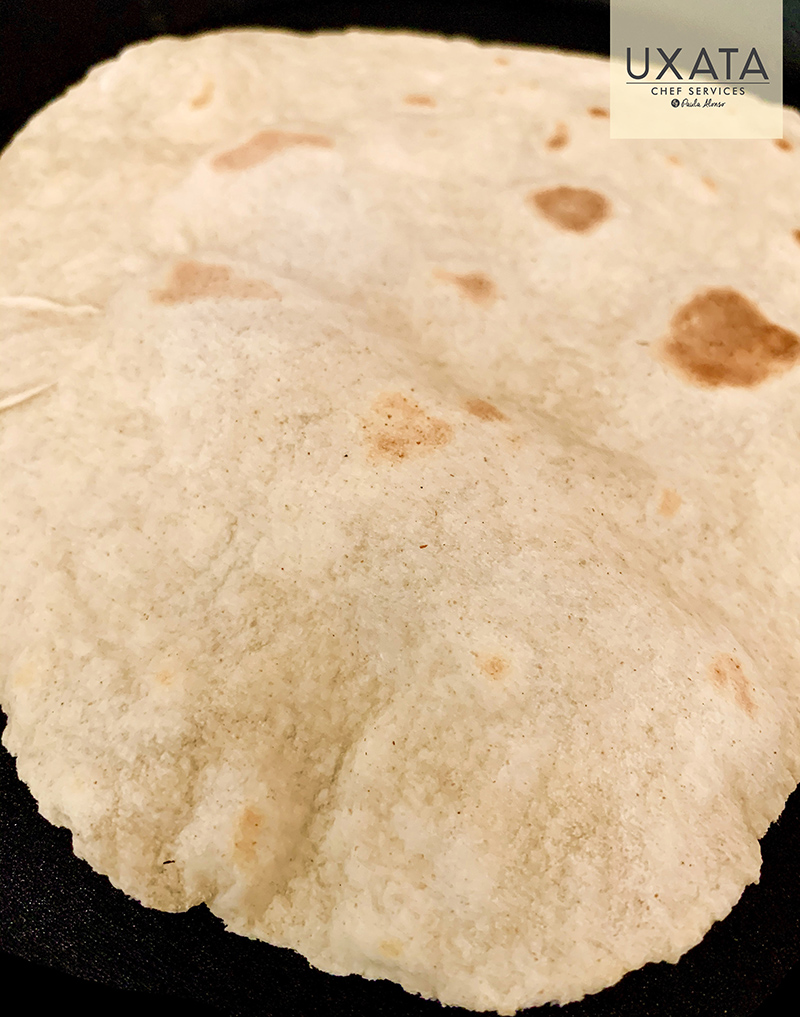 Close-up of a freshly cooked traditional Mexican tortilla, by UXATA Private Chef Services
