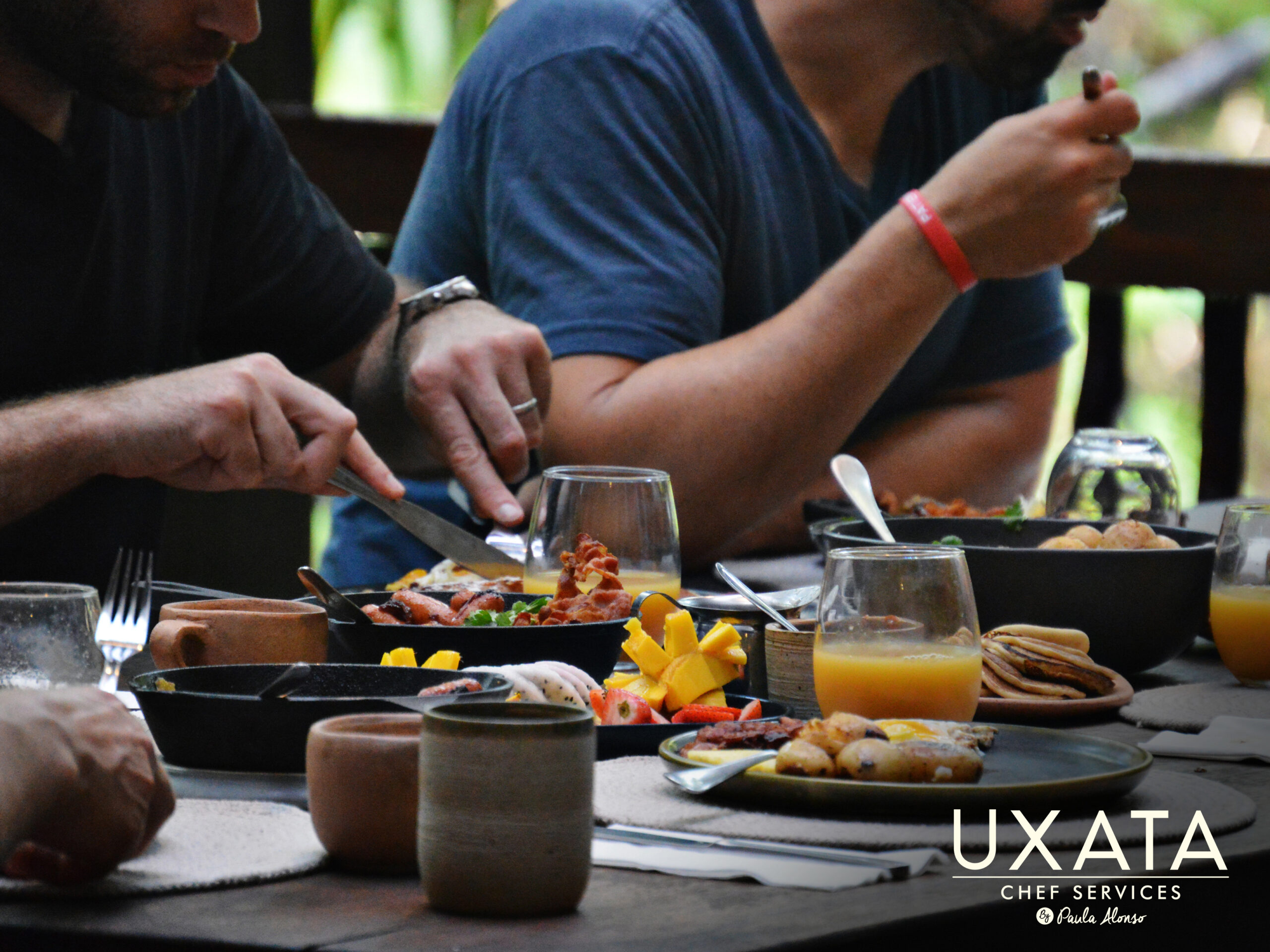 Guests enjoying a full breakfast experience provided by UXATA Private Chef Services in a Playa del Carmen villa.