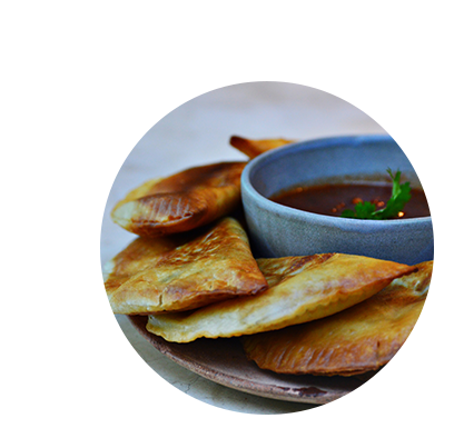 Crispy golden fried dumplings served with a savory dipping sauce by UXATA Private Chef Services in Playa del Carmen.